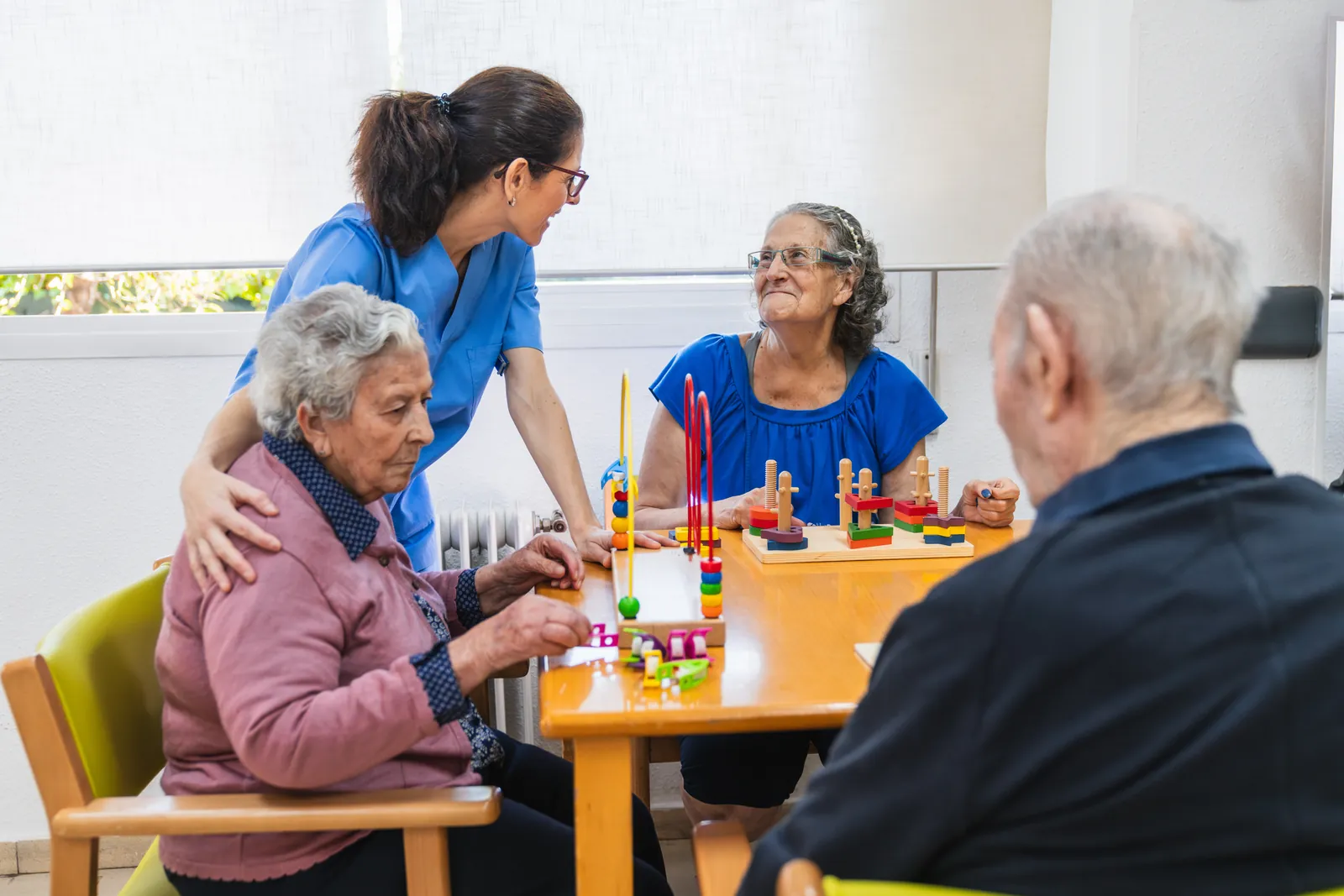 A care worker supporting residents in a care setting