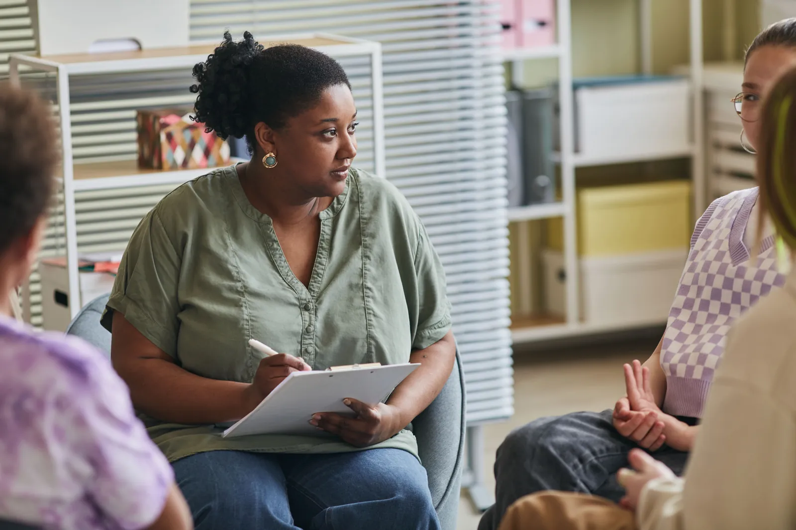 Professionals taking notes during an adult development workshop